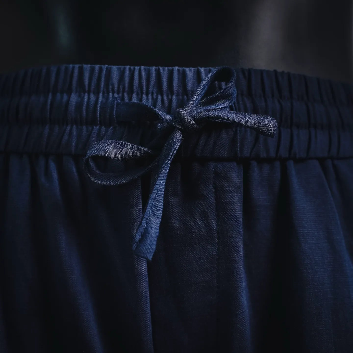 Prada pants elastic waistband with dark blue drawstring tied at center