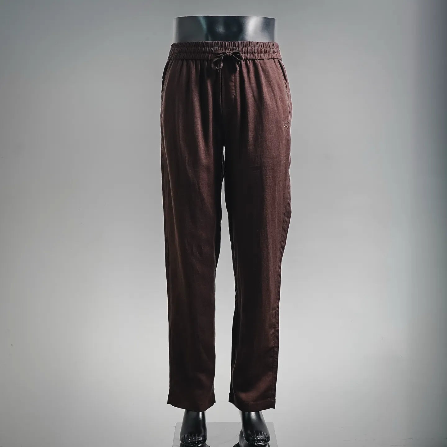 Prada pants in dark burgundy with elastic waistband and drawstring, tapered legs