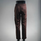 Prada pants in dark burgundy with elastic waistband, side pocket detail, tapered fit