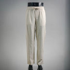 Light beige drawstring pants with elastic waist and side pockets