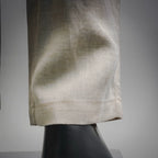 Light beige pants straight hem with subtle fabric wrinkles