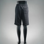 Dark gray Prada track shorts with elastic waistband, back view