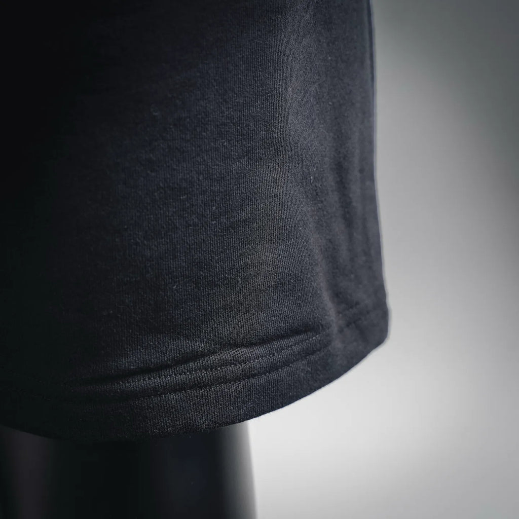 Dark gray fabric with ribbed hem cuff on track shorts