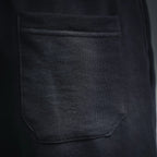 Dark gray front pocket with stitched seam on track shorts