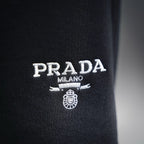 Prada Milano logo embroidery on dark gray shorts leg
