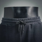 Dark gray drawstring waist on Prada track shorts