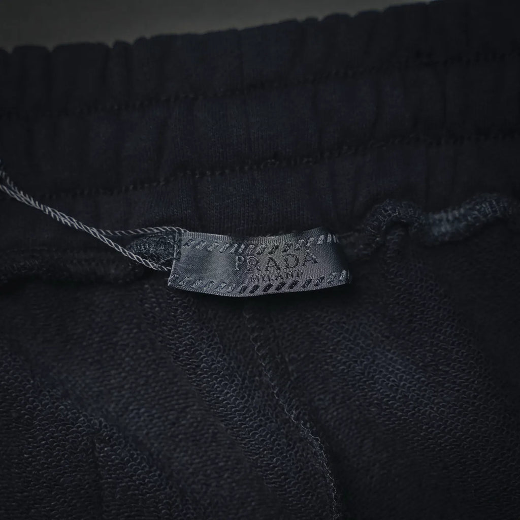 Prada inner label on dark gray shorts waistband seam