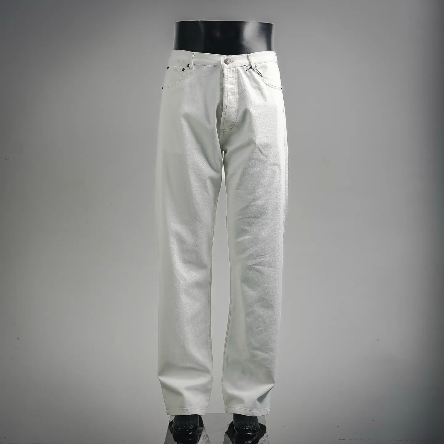 White Prada pants with button-fly, belt loops, and stitched side pockets.