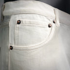 White Prada pants front pocket with dark buttons and rivets.