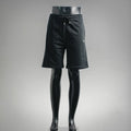 Black knee-length drawstring shorts with elastic waistband