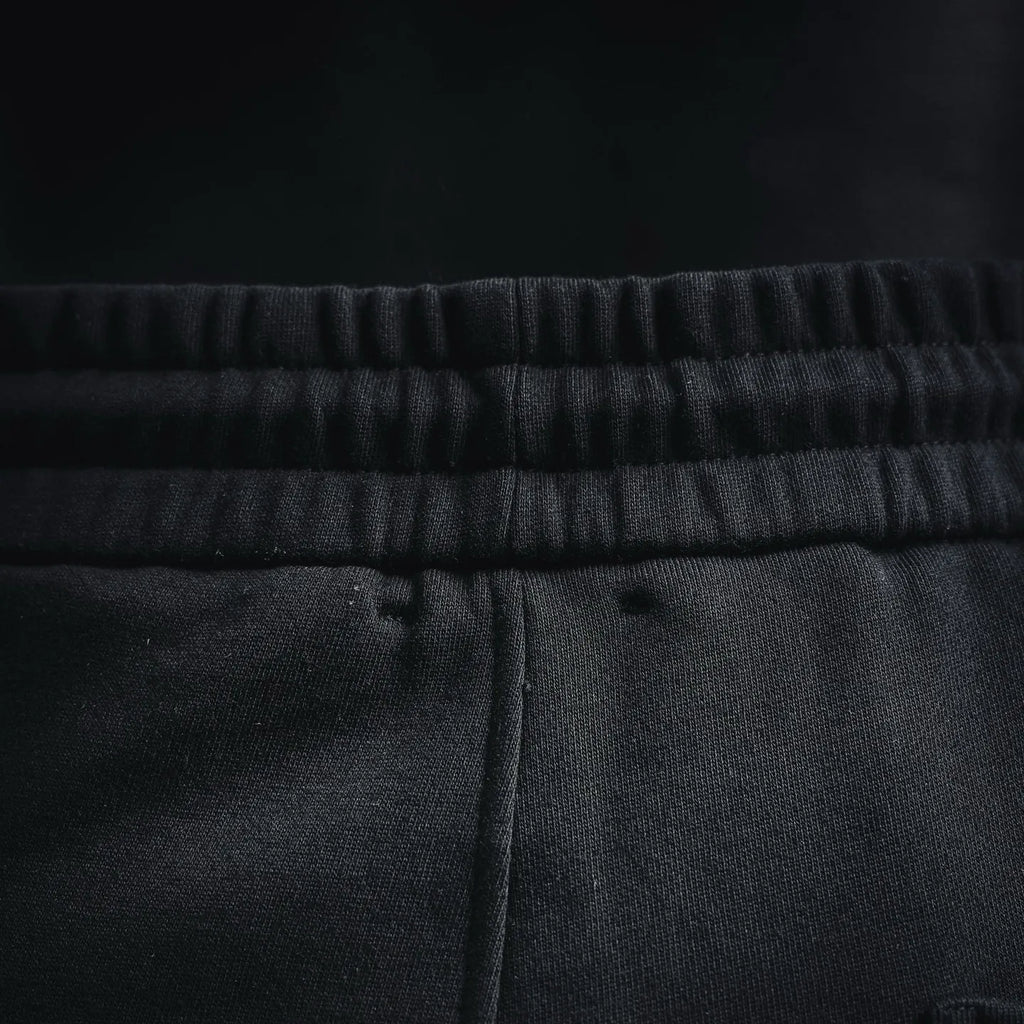 Elastic waistband with textured knit look on black shorts