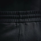 Elastic waistband with textured knit look on black shorts