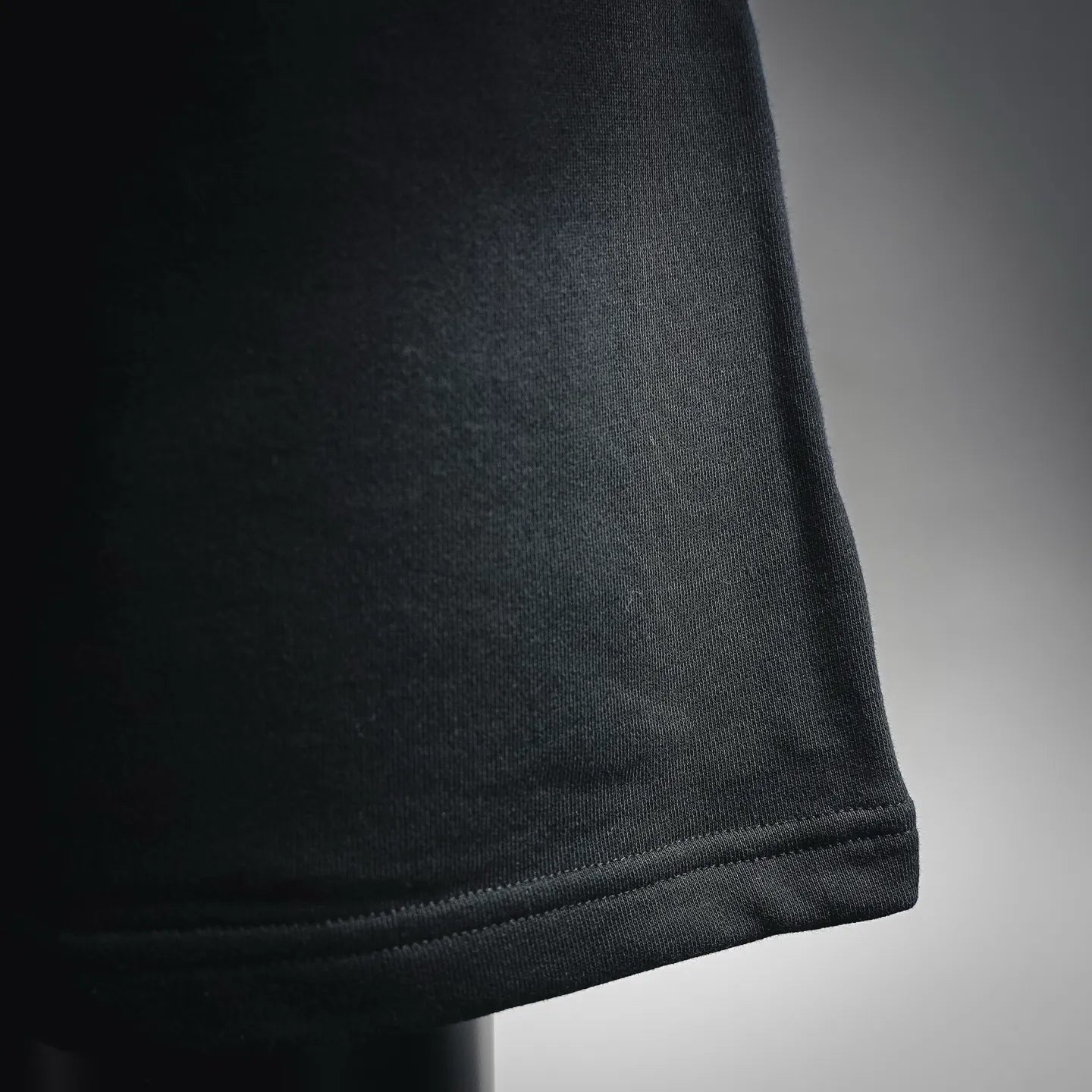 Straight hem with ribbed trim on black shorts