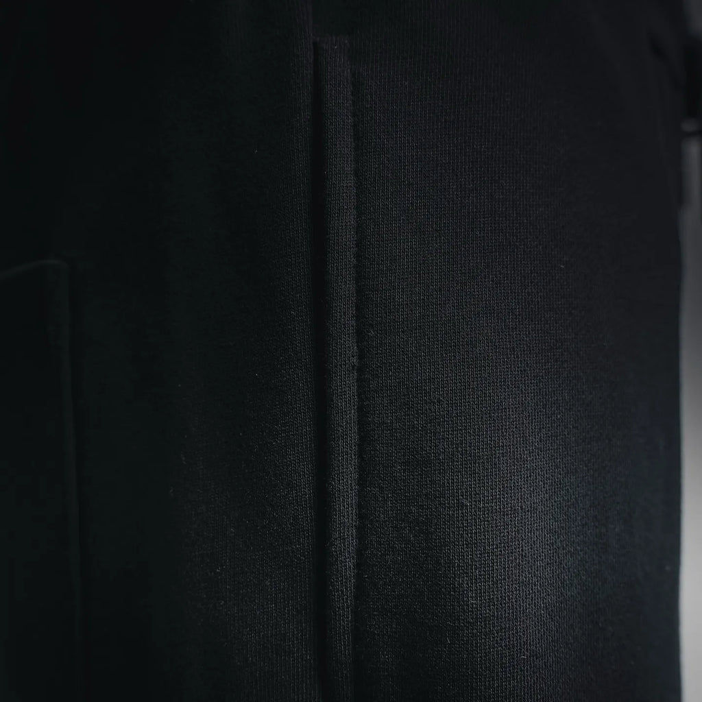 Black shorts side panel with visible seam detail