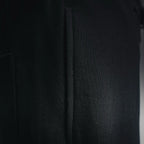 Black shorts side panel with visible seam detail