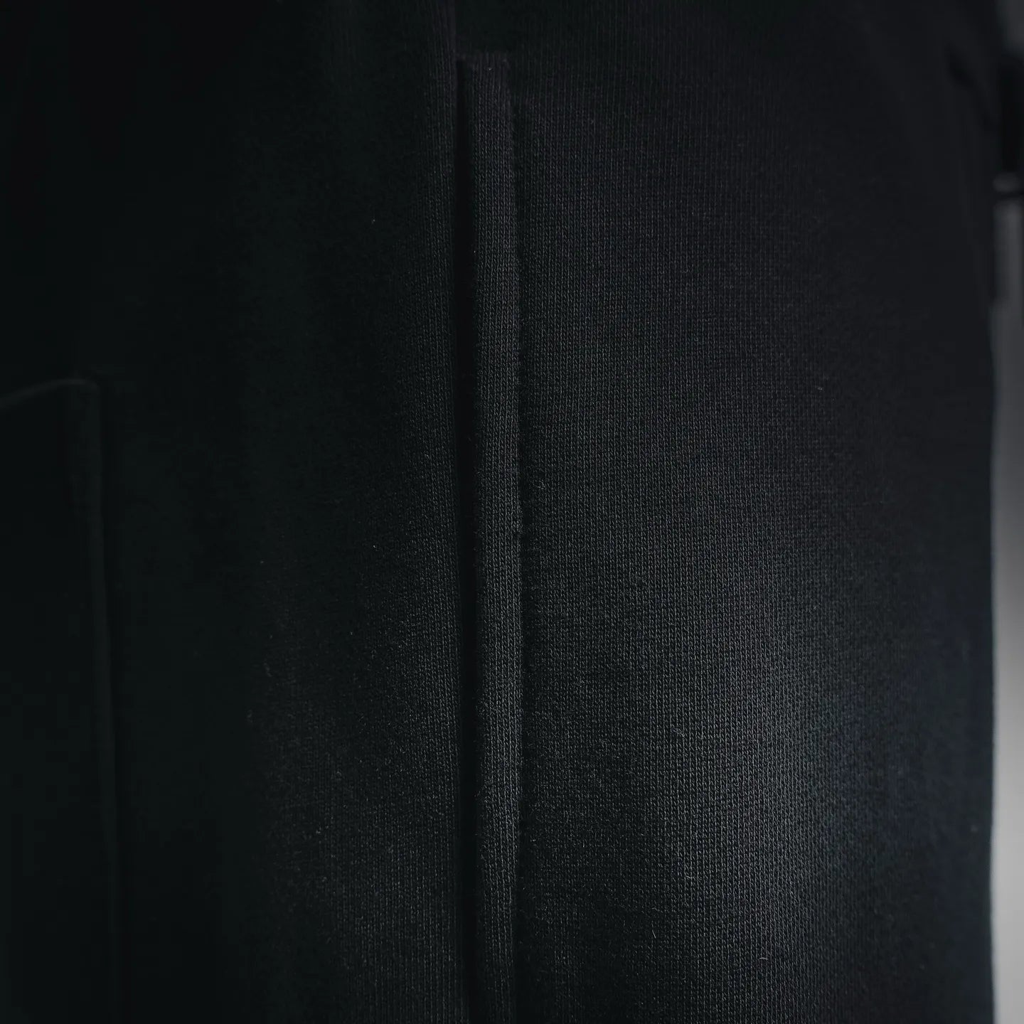 Black shorts side panel with visible seam detail