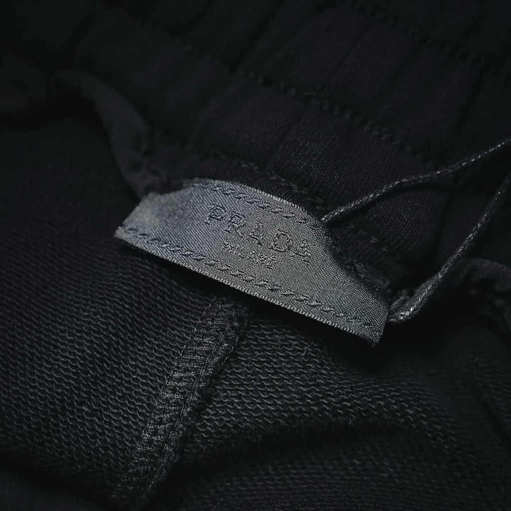 Inside label stitched on black shorts fabric