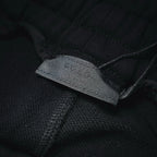 Inside label stitched on black shorts fabric