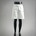 White drawstring shorts with elastic waistband and side pockets