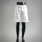 White drawstring shorts with elastic waistband and side pockets