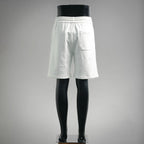 White drawstring shorts with elastic waistband and side pocket