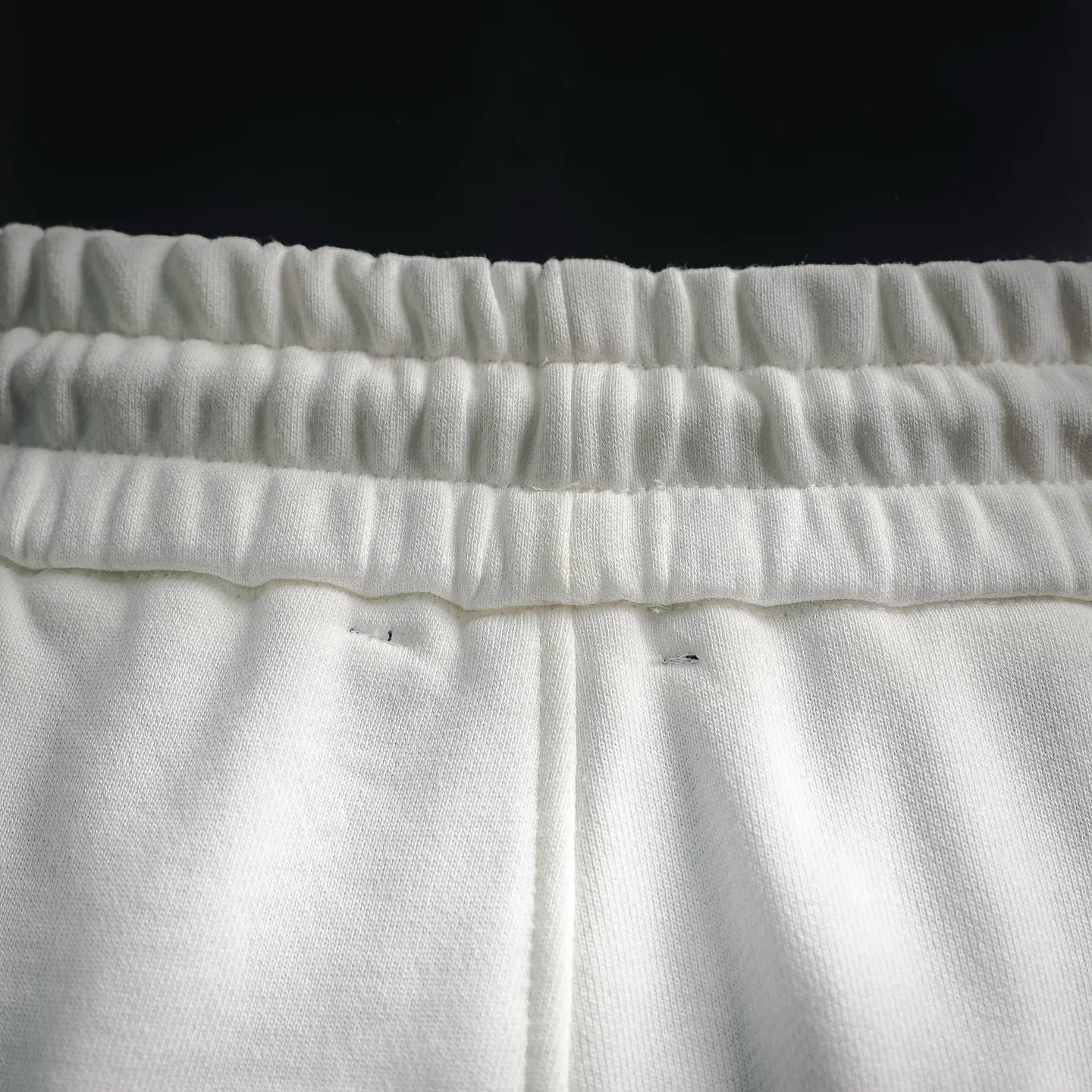 White shorts waistband with drawstring channel and stitched hem