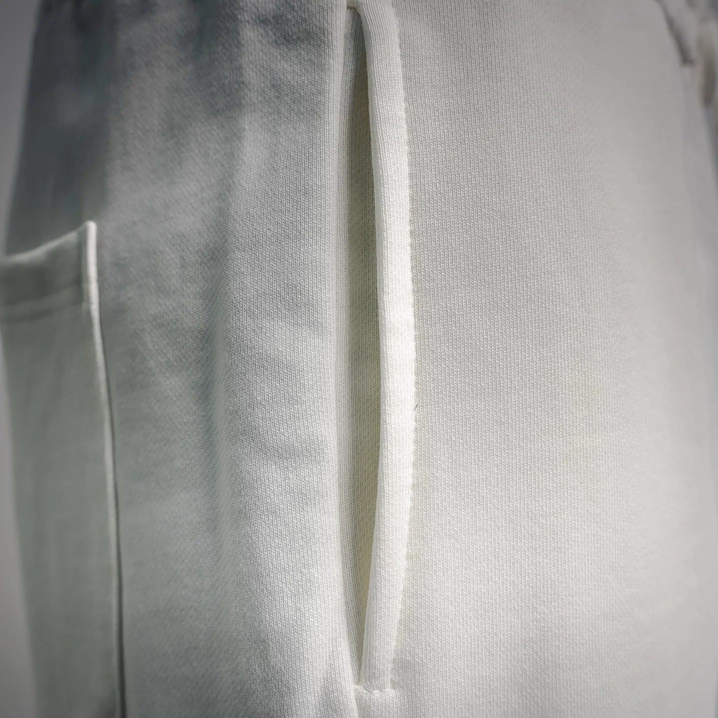 White shorts with hanging drawstring cord and side seam