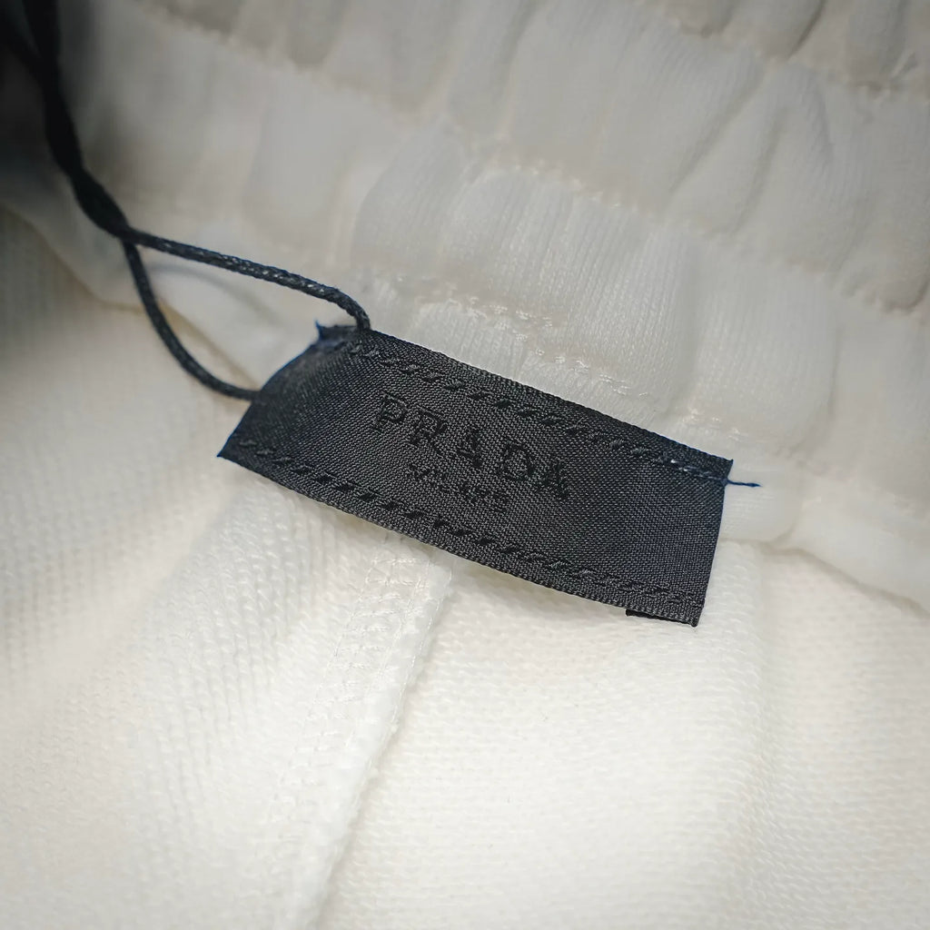 Prada size label tag on white shorts hem