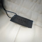Prada size label tag on white shorts hem