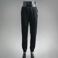 Prada black pants with elastic waistband, drawstring, and tapered jogger cuffs