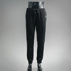 Prada black pants with elastic waistband, drawstring, and tapered jogger cuffs