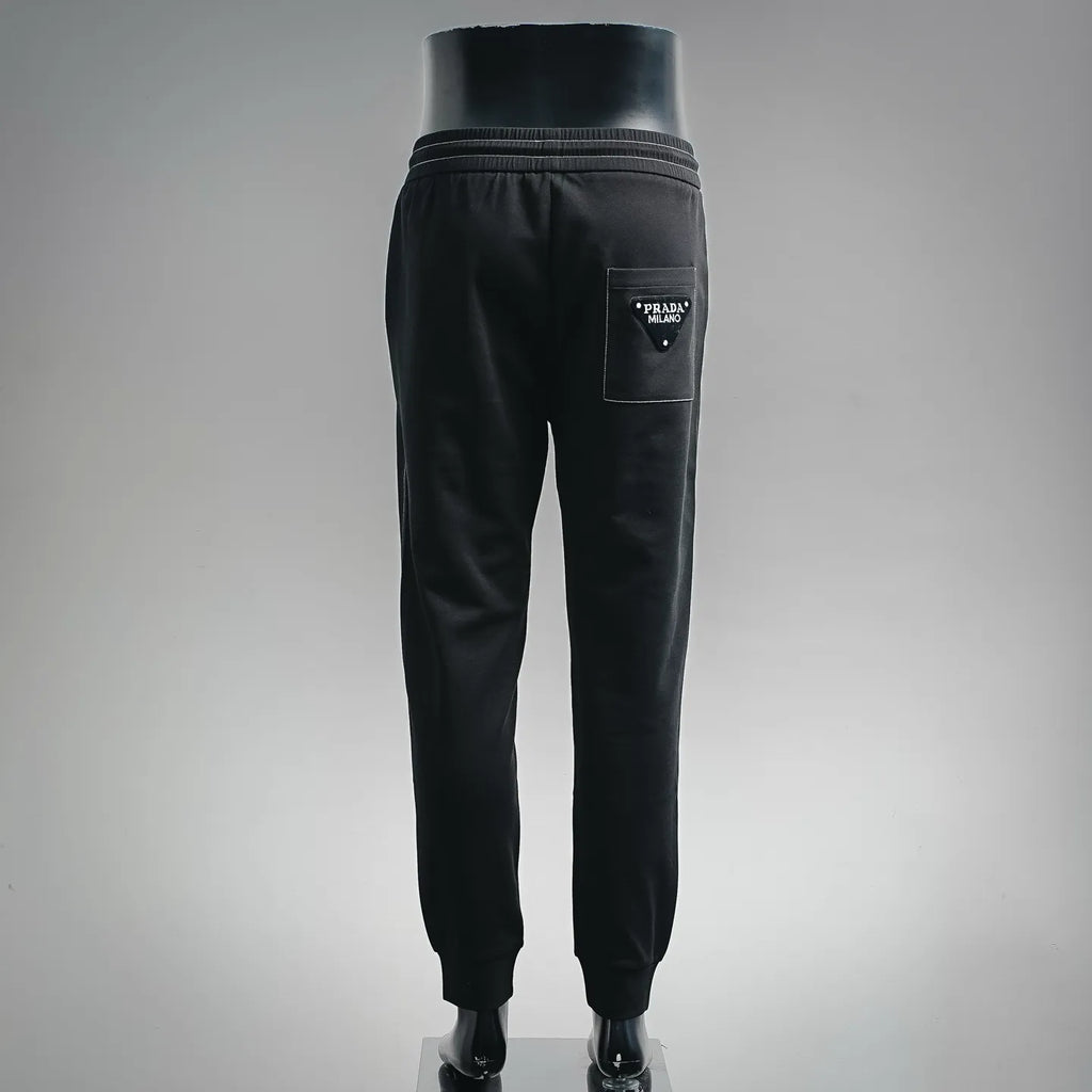 Prada black pants, back view with elastic waistband and back pocket logo patch