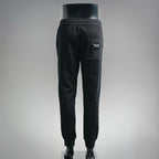 Prada black pants, back view with elastic waistband and back pocket logo patch