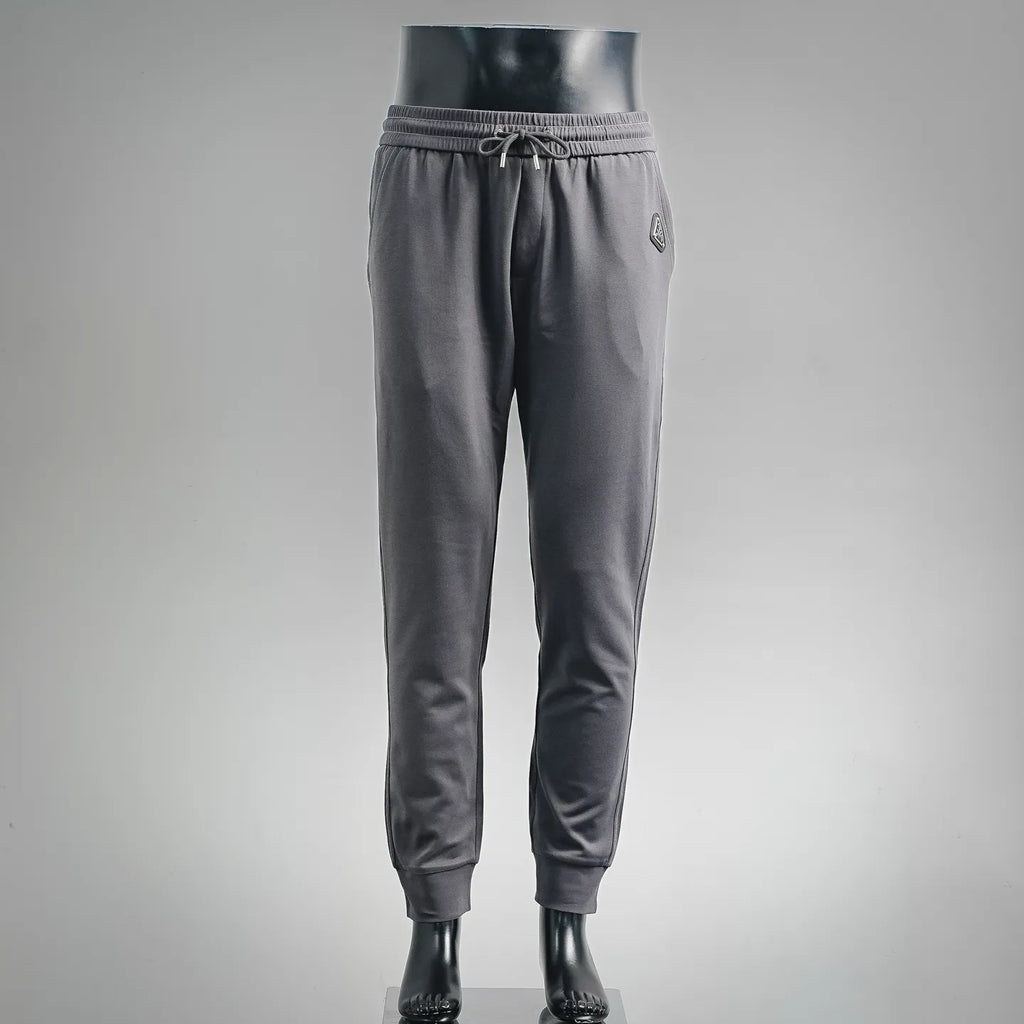 Dark gray drawstring jogger pants with elastic cuffs