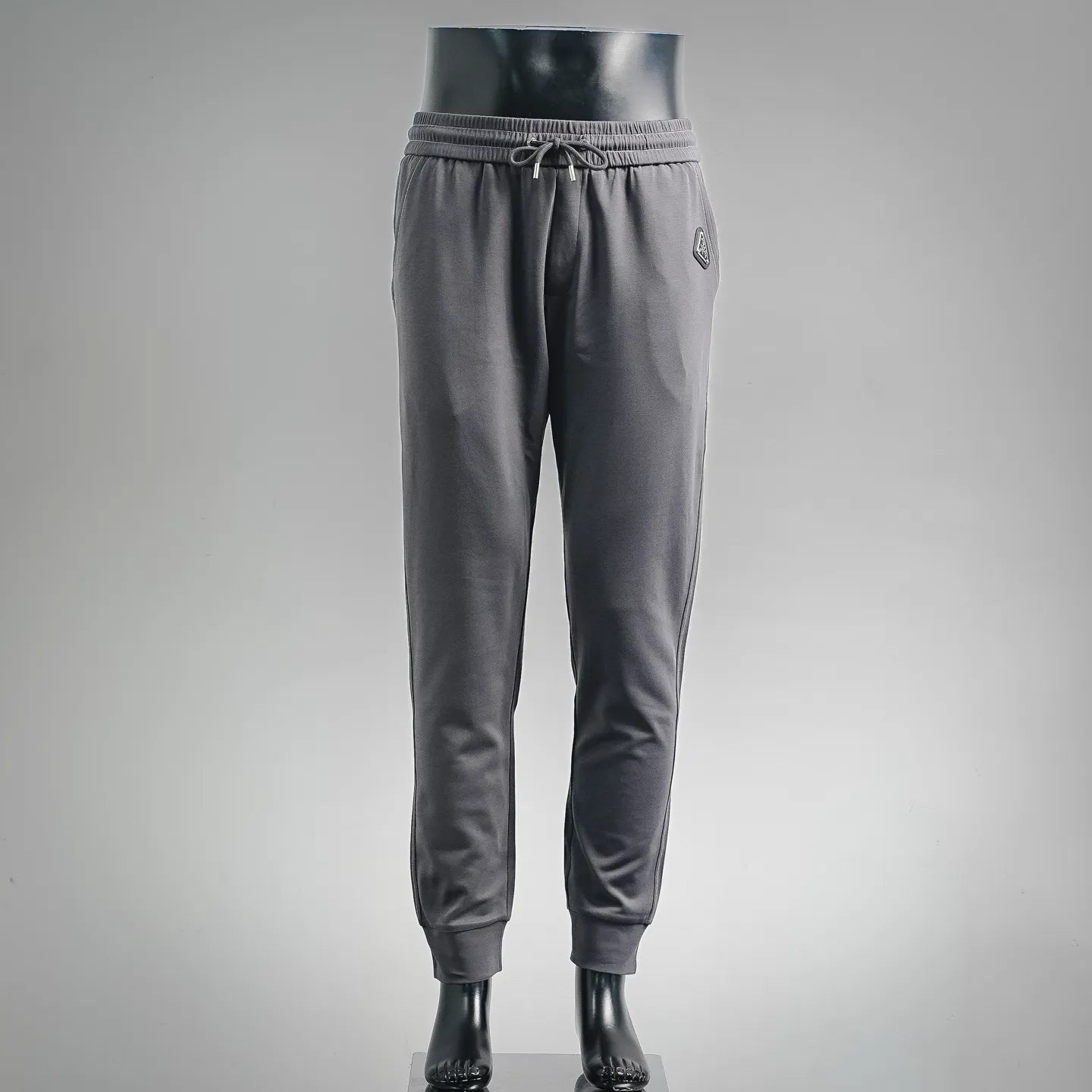 Dark gray drawstring jogger pants with elastic cuffs