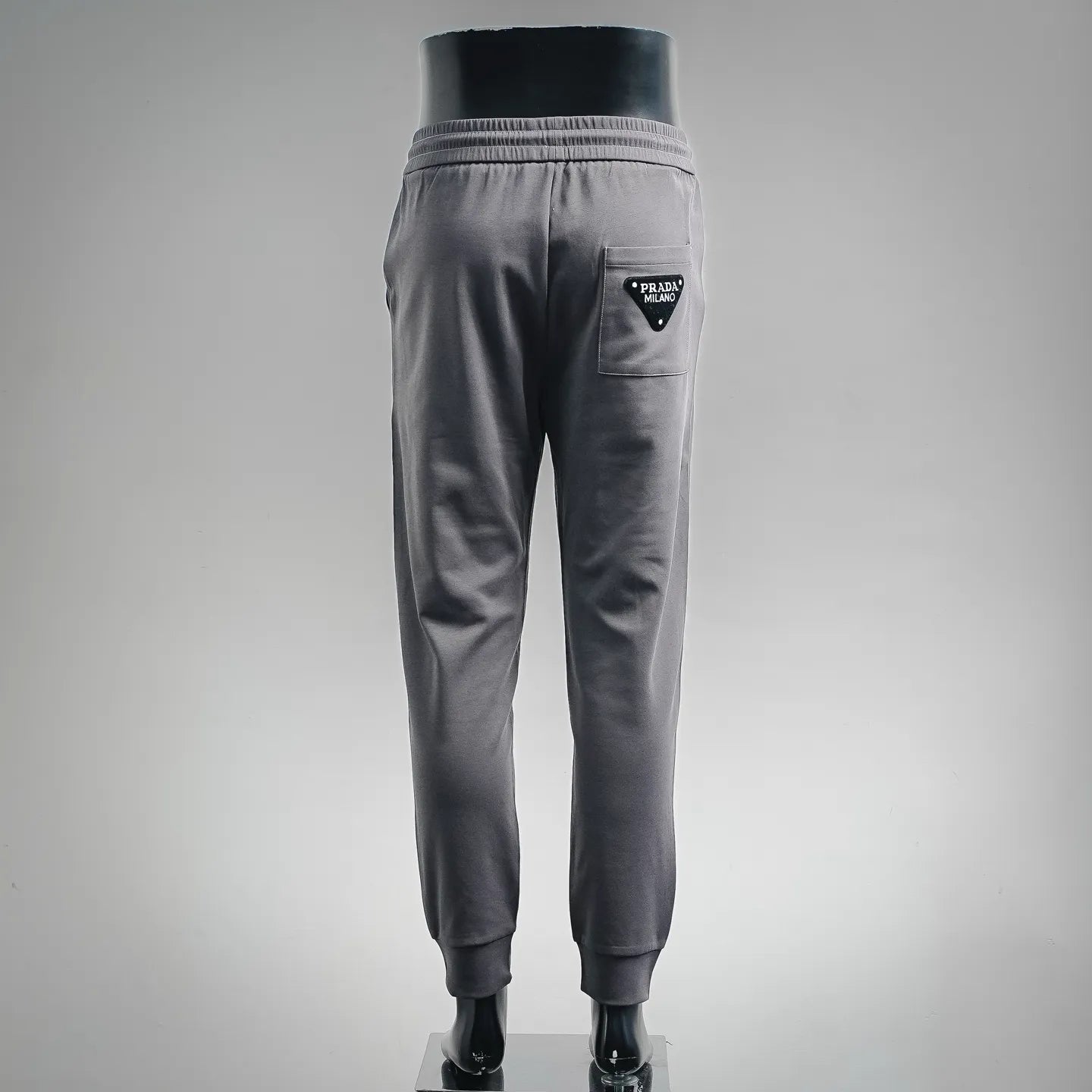 Dark gray jogger pants with back pocket and elastic cuffs