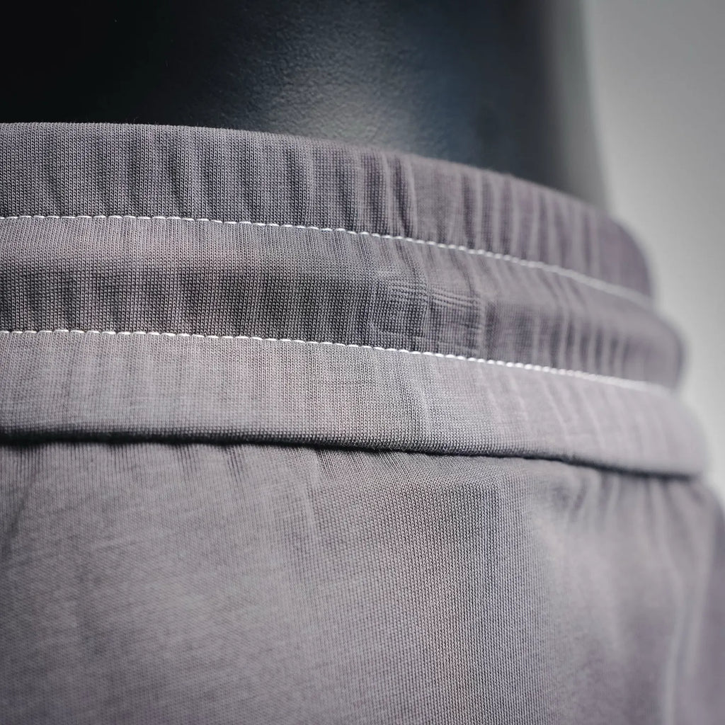 Dark gray waistband with stitched elastic seam