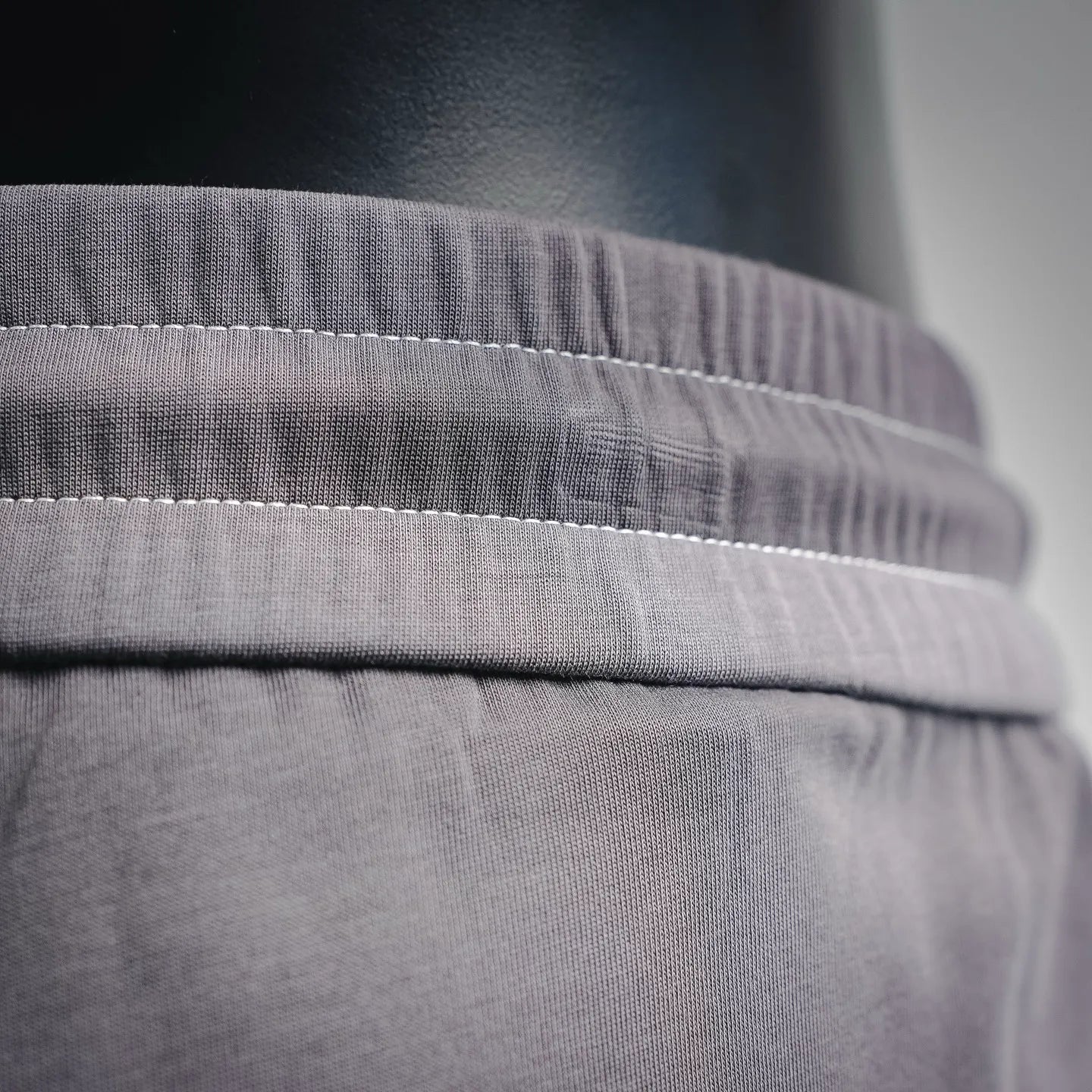 Dark gray waistband with stitched elastic seam