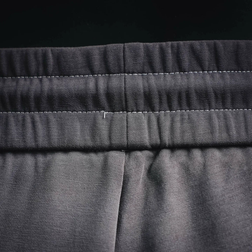 Dark gray drawstring waistband with center seam detail