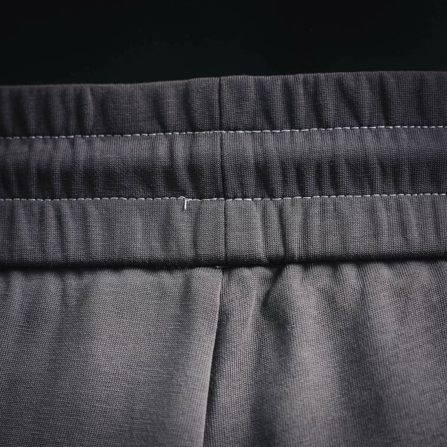 Dark gray drawstring waistband with center seam detail