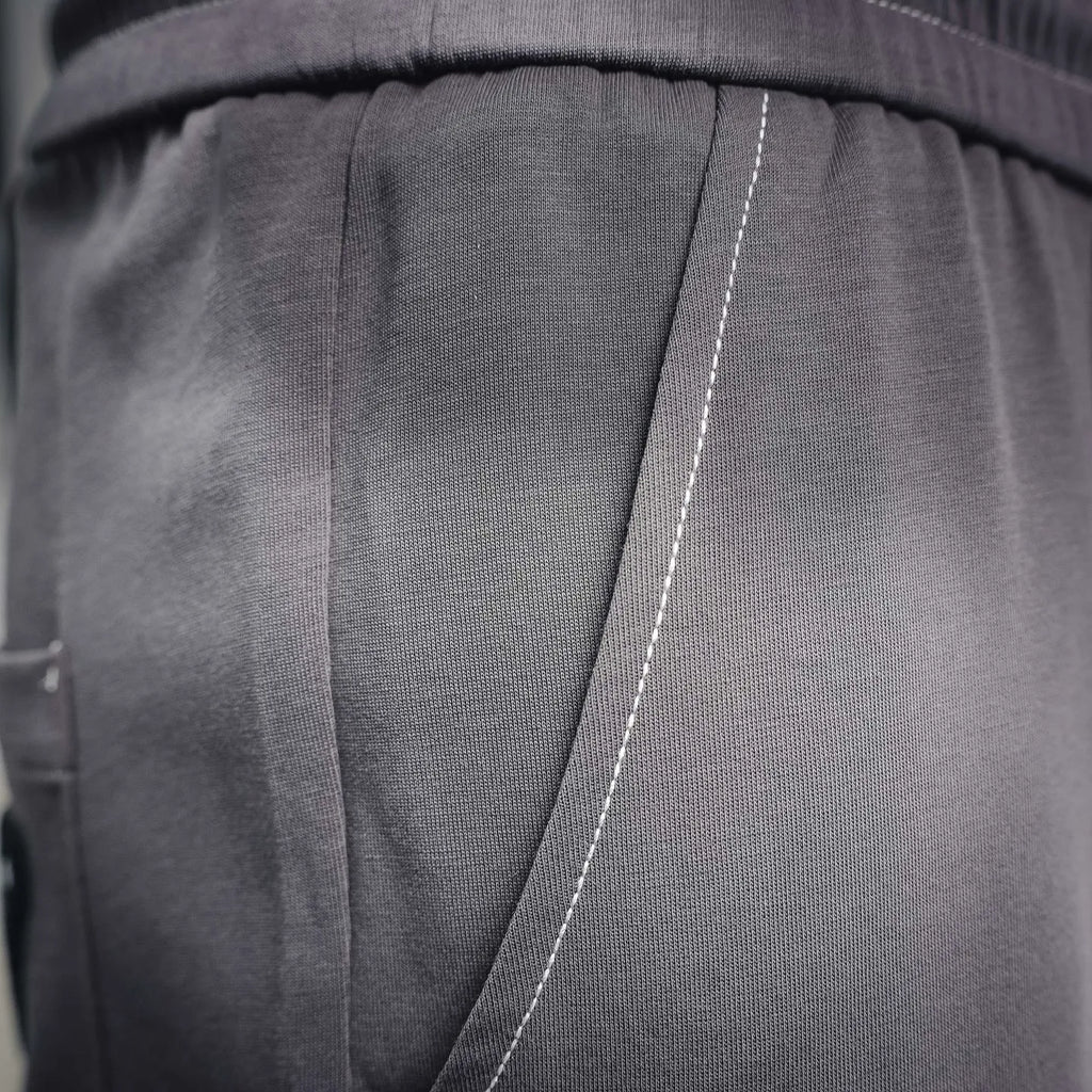 Dark gray pleated waistband panel detail