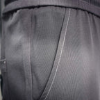 Dark gray pleated waistband panel detail