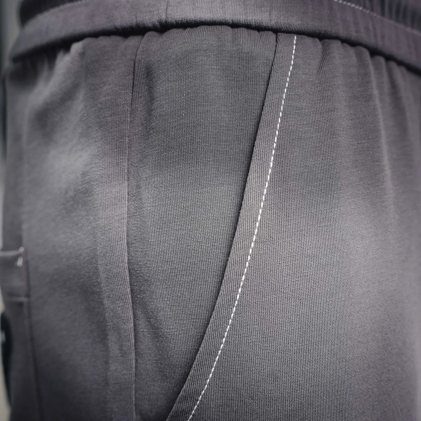 Dark gray pleated waistband panel detail