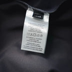 Inside care label on dark gray pants