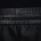 Prada black pants close-up of elastic waistband and stitched seams