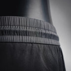 Prada black pants close-up of waistband ruffle and fabric texture