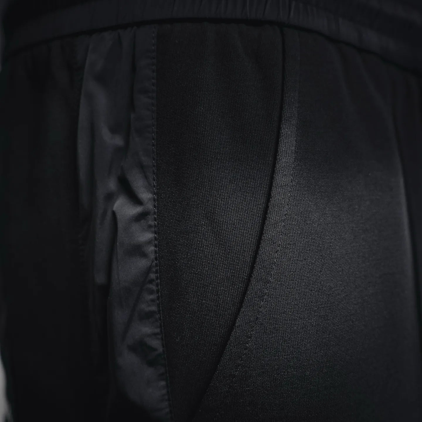 Prada black pants close-up of side panel and pocket seam