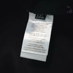 Prada black pants care label showing size XXL and washing instructions