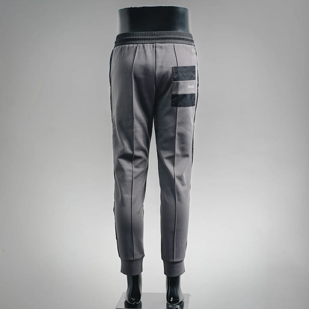 Prada dark gray jogger pants with back patch pocket and ribbed ankle cuffs