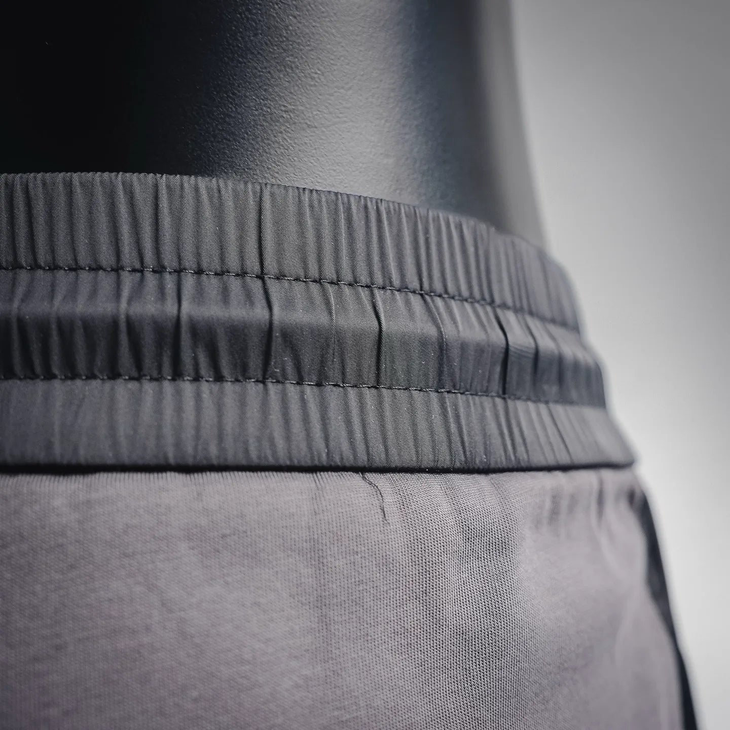 Prada dark gray waistband and stitching detail on stretch jogger pants